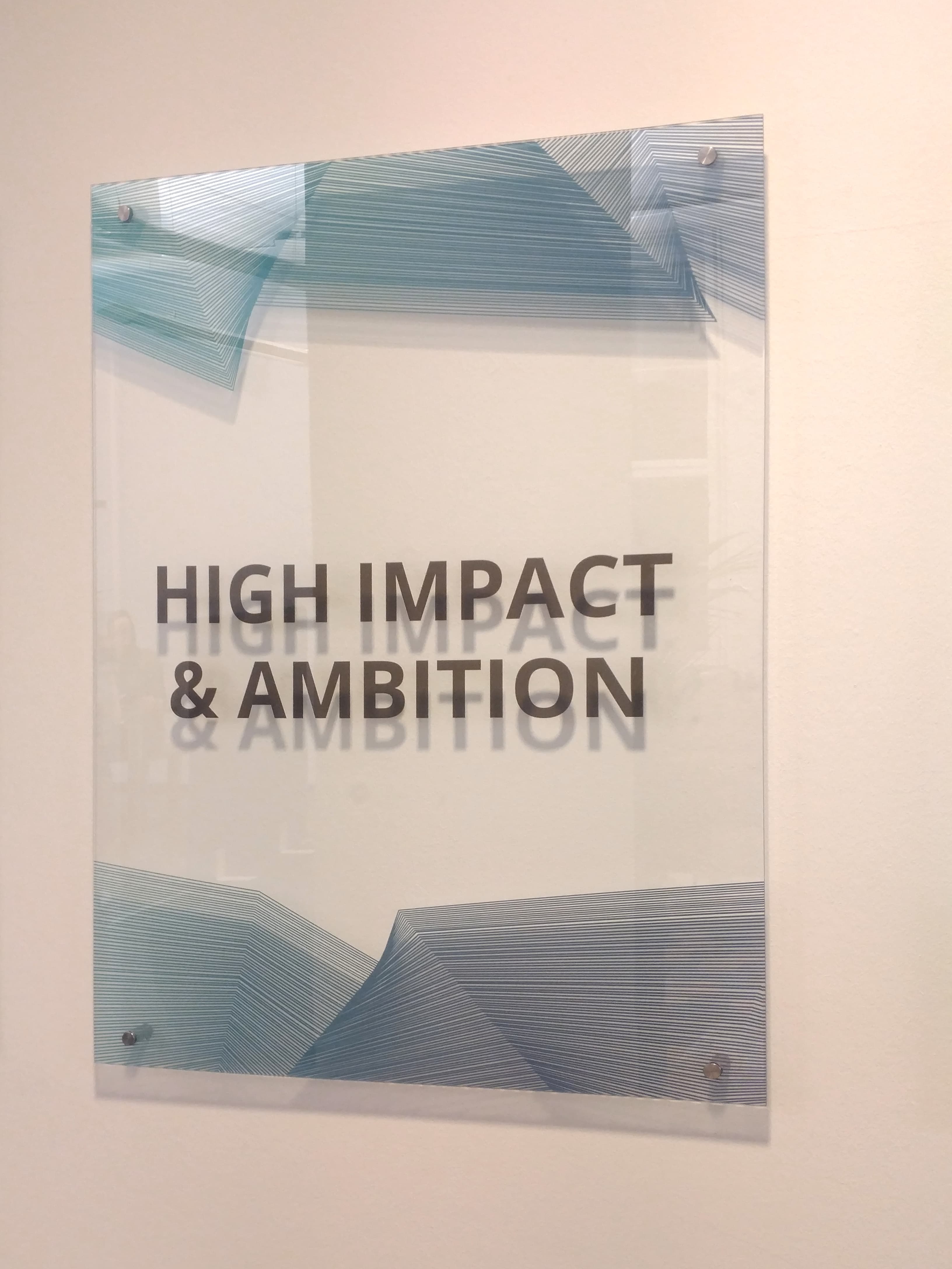 Company values printed on 6 glass panels — office interior installation Berlin