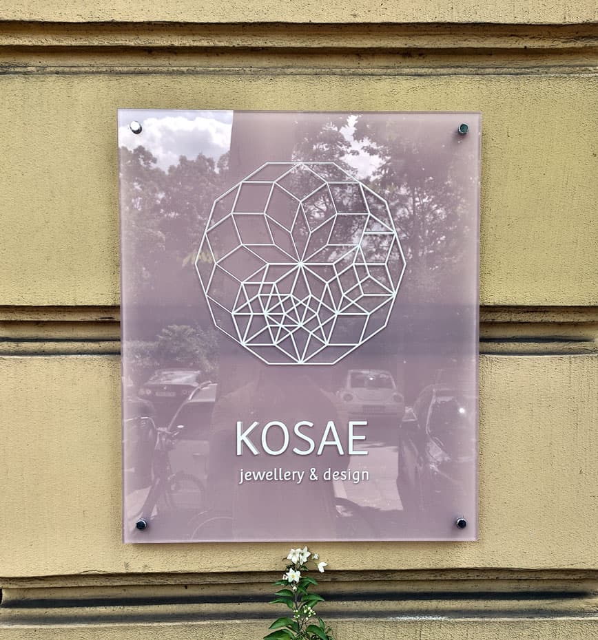 Translucent glass sign with shadow effect β @kosae_jewellery, Berlin